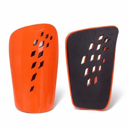 Ventilated football shin guards in orange and white